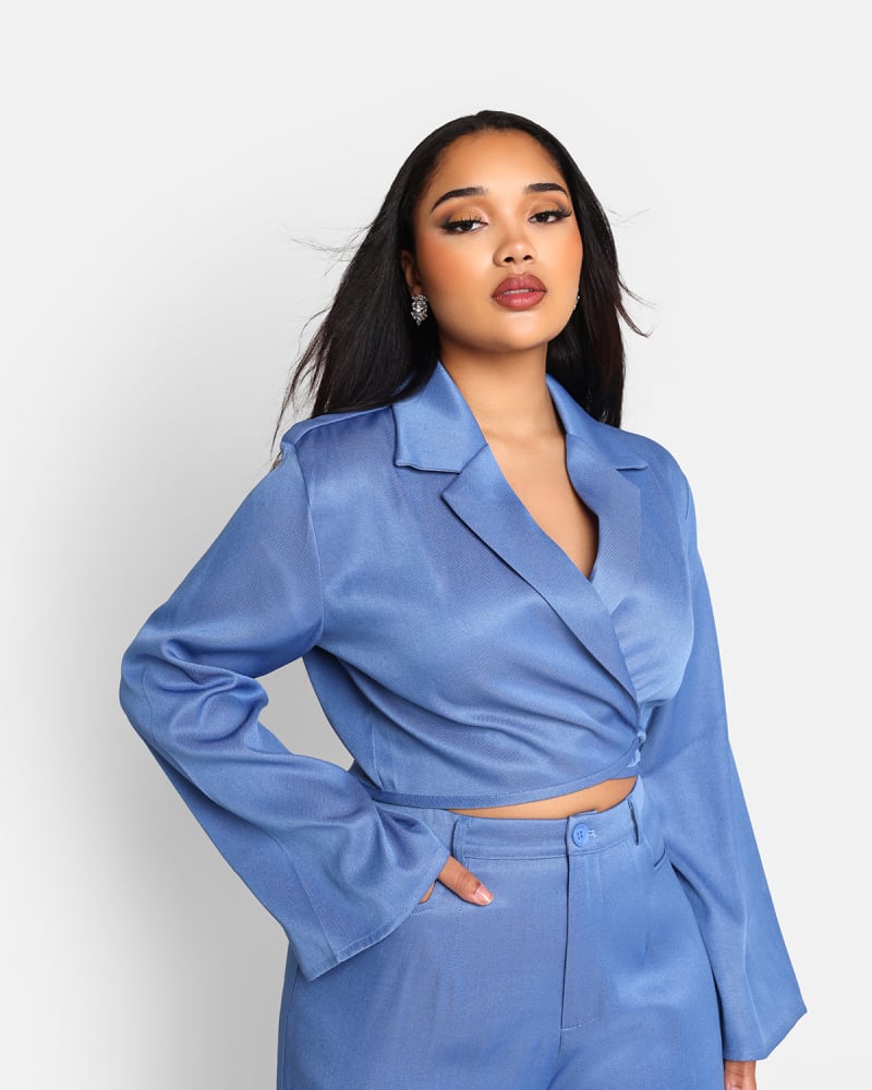 Side of a model wearing a size 3x Rebdolls Women's Jorja Cropped Tie Waist Blazer in Dark Blue by Rebdolls. | dia_product_style_image_id:327828